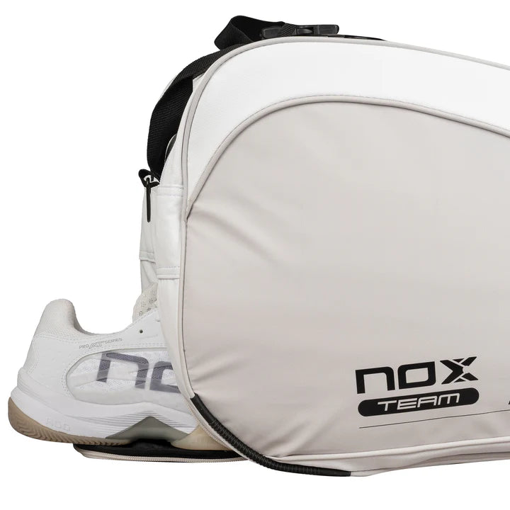 White sports padel bag and shoe with 'NOX' branding on a white background