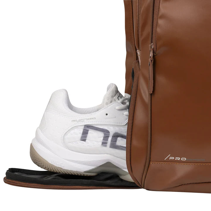 NOX Pro Series Camel backpack open showing padded racket compartment, shoe pocket and accessories storage