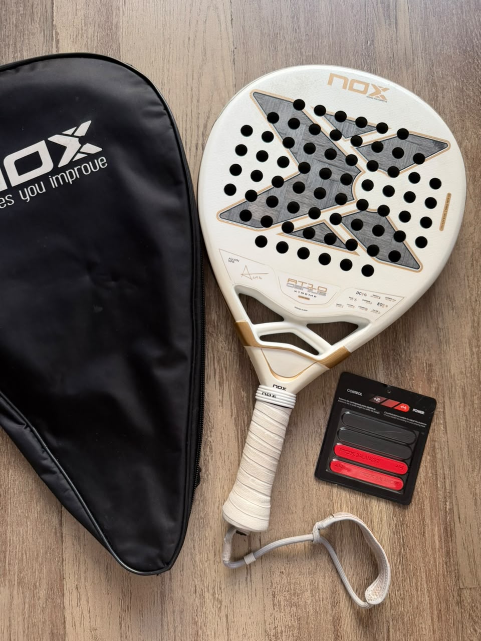 NOX AT10 12K 2026 pre-owned with cover, all weights, protector and grip included — The Padel Market SA
